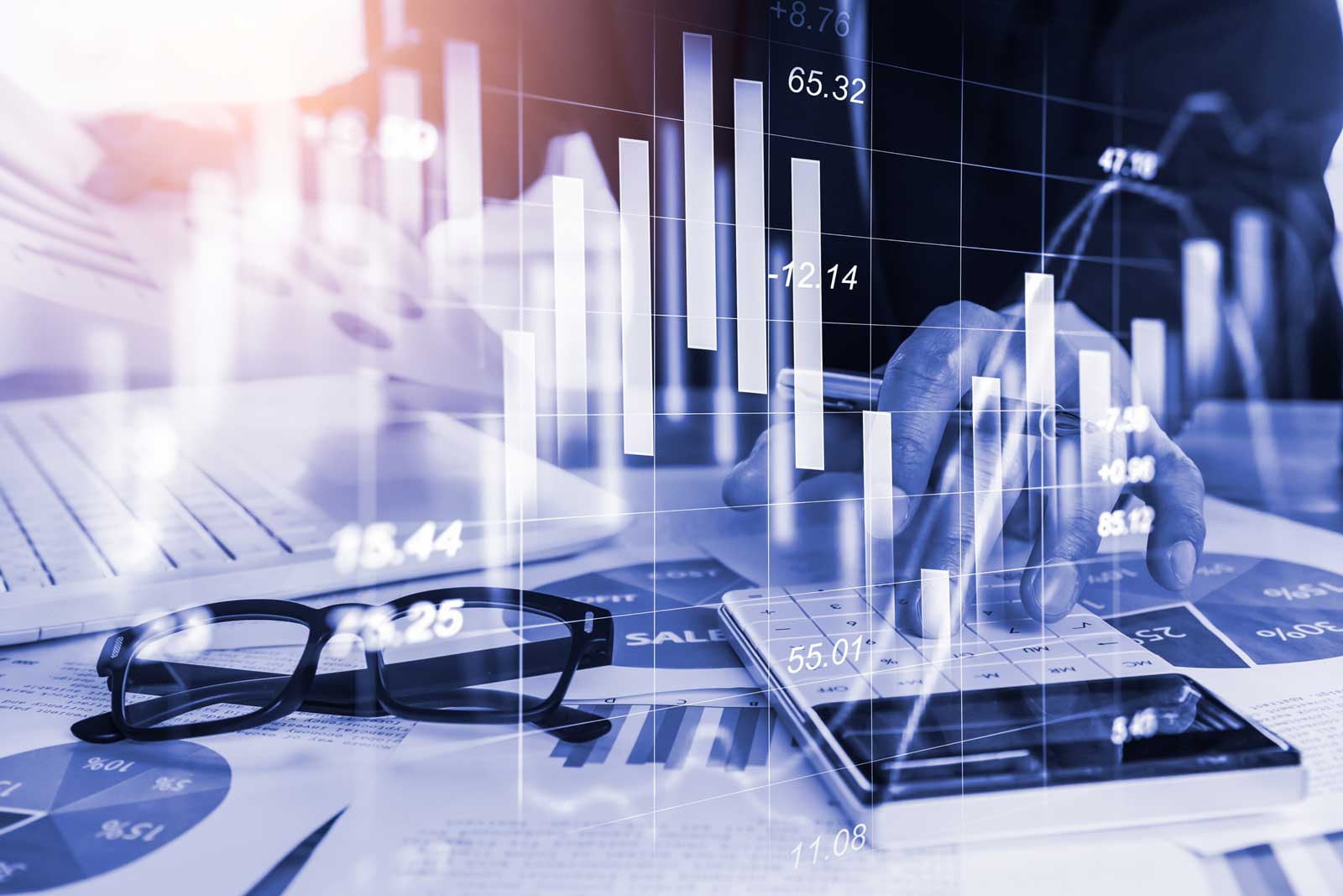 person reporting on computer, calculator, abstract stocks