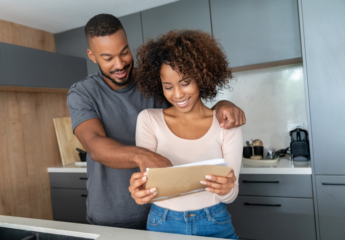 couple viewing unclaimed property letter